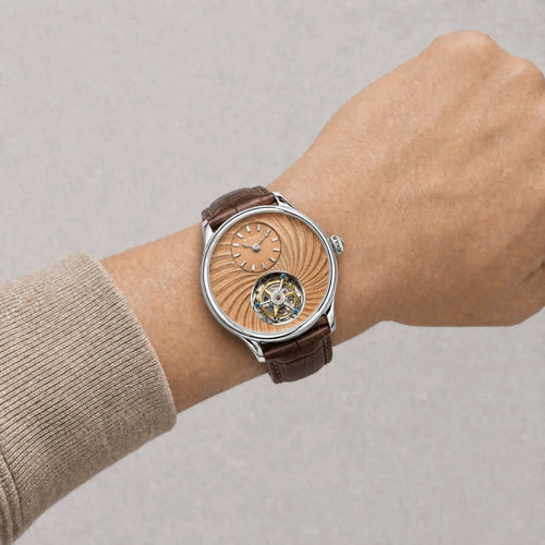 HORAE V Gravitas Salmon Rose Guilloché watch worn on wrist