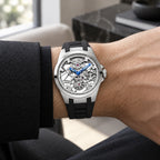 T306M platinum tone tourbillon worn with a dark tailored sleeve