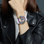 TIELBO T711 watch with clear case, rainbow bezel and white strap, angled wrist close-up.